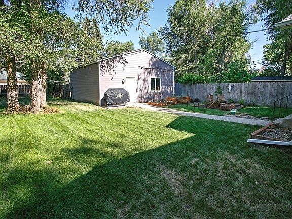 Spacious backyard that has its own sprinkler system.