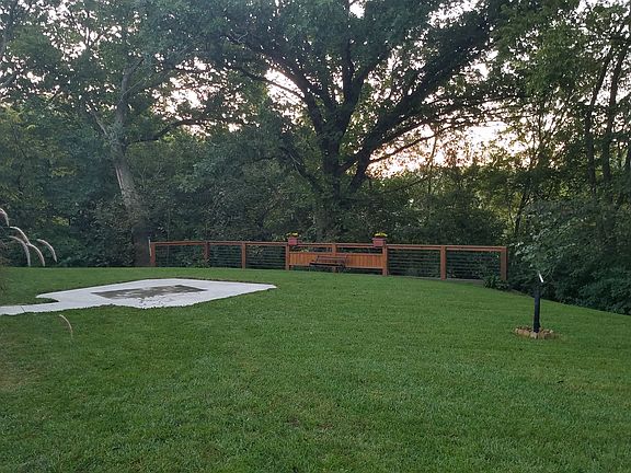 South side of home, w/ Beautiful yard and landscaping. Concrete slab great for Fire Pit, Barbequing or just relaxing in your comfy lawn furniture and listening to Quiet...

