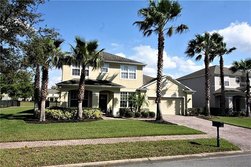 Stately Elevation Features Brick Drive & Sidewalk