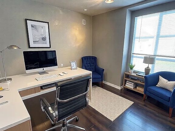 Bedroom/office. This image is virtually staged