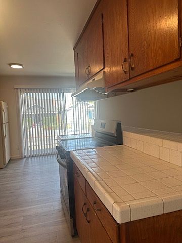 More views of the kitchen and cabinets and one of the balconies/patios