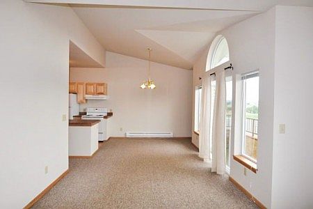 Dining room, living room with vaults, and straight out access to deck