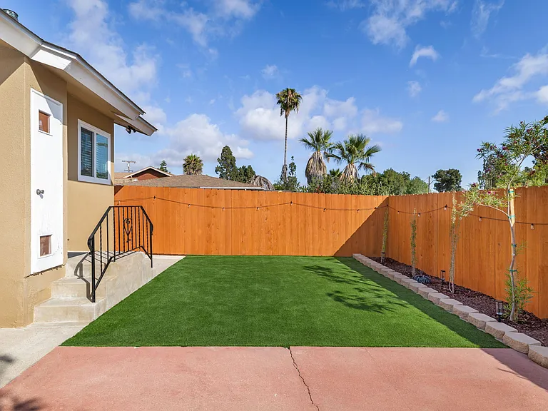 Features a large turf yard perfect for lawn games, running around with pets, or relaxing with the kids under the San Diego sun.