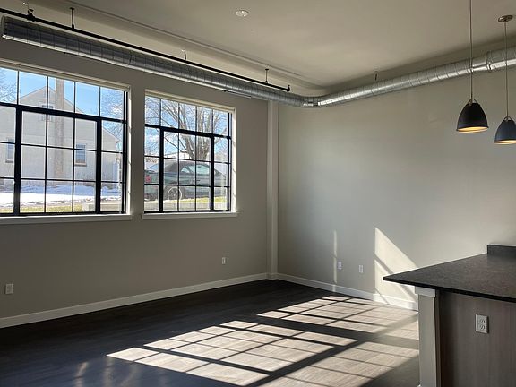 Industrial sized windows and exposed ductwork