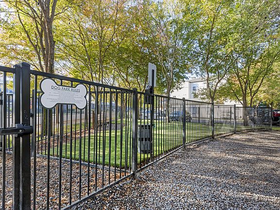 Our newly renovated dog park is now open, featuring fresh turf and plenty of space for your furry friends to play and socialize.