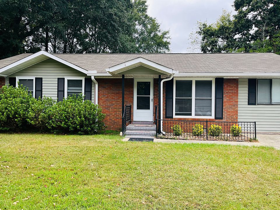 Charming single-family home with landscaped front yard and mature trees.