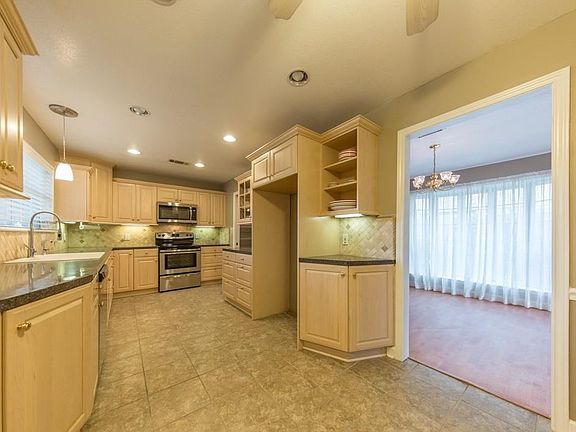 Gorgeous spacious kitchen with stainless steel appliances, ample counter and cabinet space, recessed lighting, and a large farm sink!