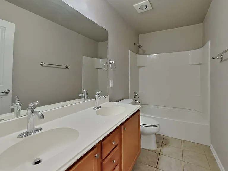 Brightly lit bathroom with neu