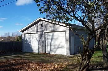 Large additional building with high overhead doors, great for boat storage