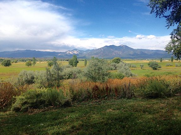The view in summer across to the Sangre de Christo mountains, they are covered in snow in winter.