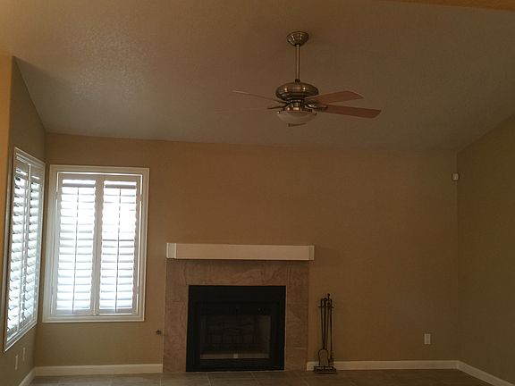 Fireplace & ceiling fan in great room