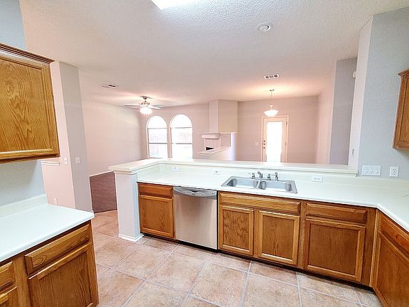 Kitchen opens to living 