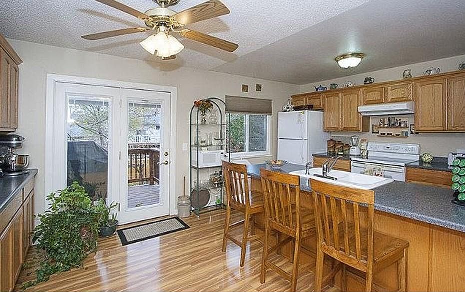 Kitchen looking to back yard, upper level deck