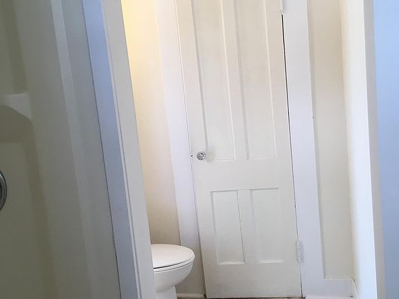 spacious bathroom with single stall shower and closet
