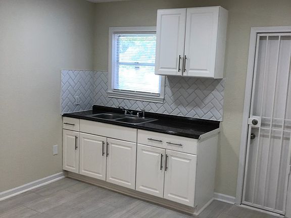 Kitchen area 1 - brand new stainless steel appliances - stove, refrigerator, and microwave are included.