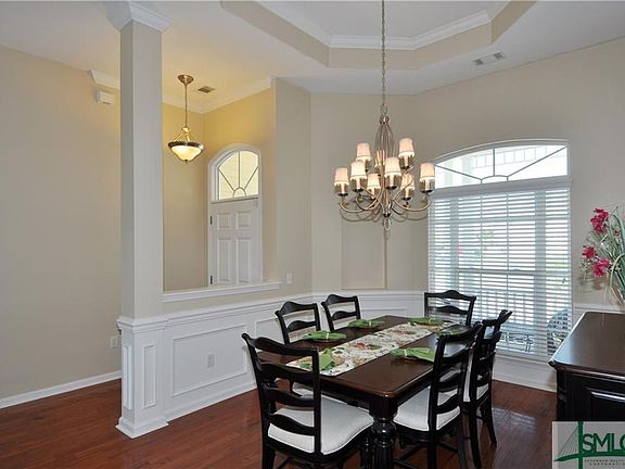Open Foyer, 9'+ ceilings and gorgeous hardwood floors welcome you for a starter as you enter into the dining room with tray ceilings.