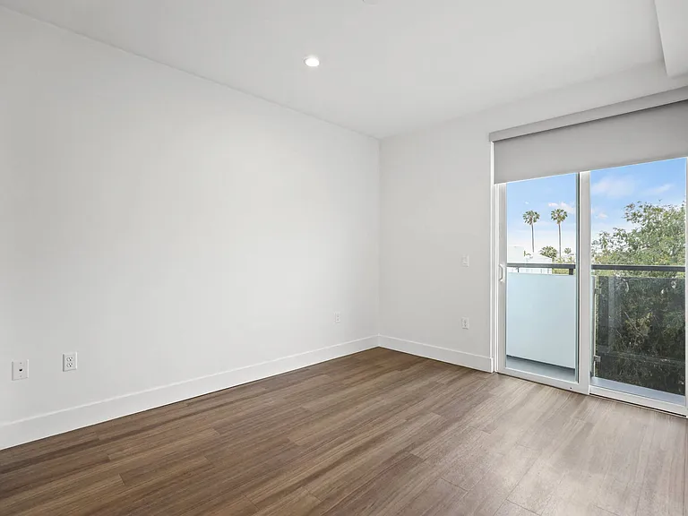 Bedroom with Balcony and Vinyl Flooring