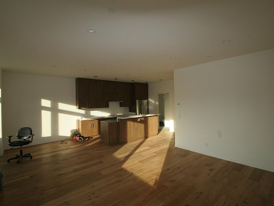 open kitchen with new stainless high end appliances