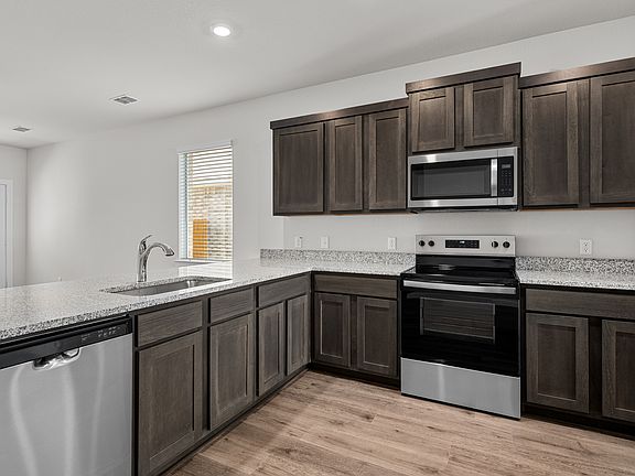 The kitchen has a wonderful breakfast bar.