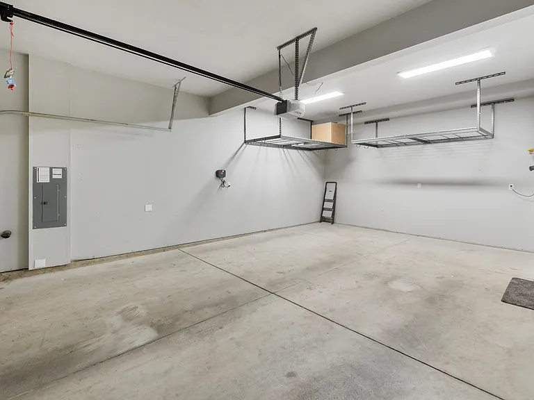 Garage has 2 recently added overhead SafeRacks for extra storage