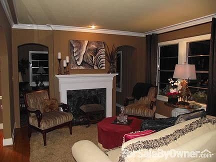 Den is open to kitchen
						:
						Den with French doors opening to ground level deck and private fenced backyard