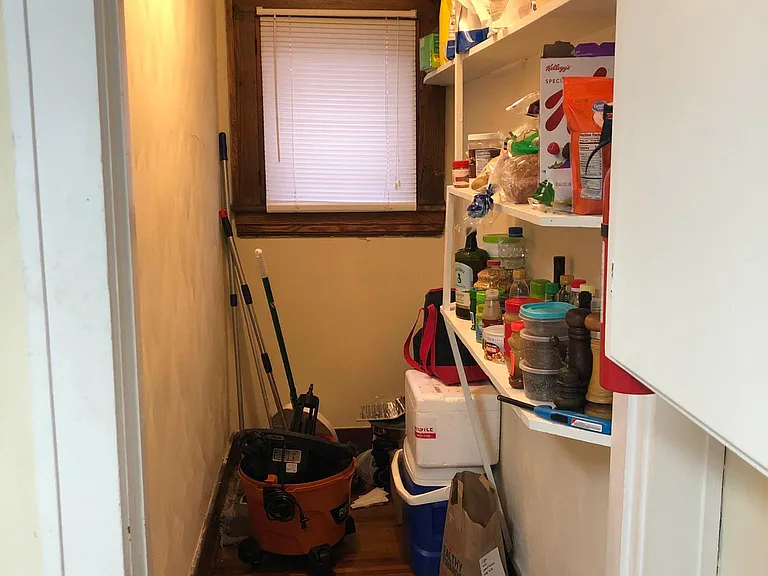 Walk In Pantry w/ Additional Shelving for Storage, Window and Original Hardwood Floors.