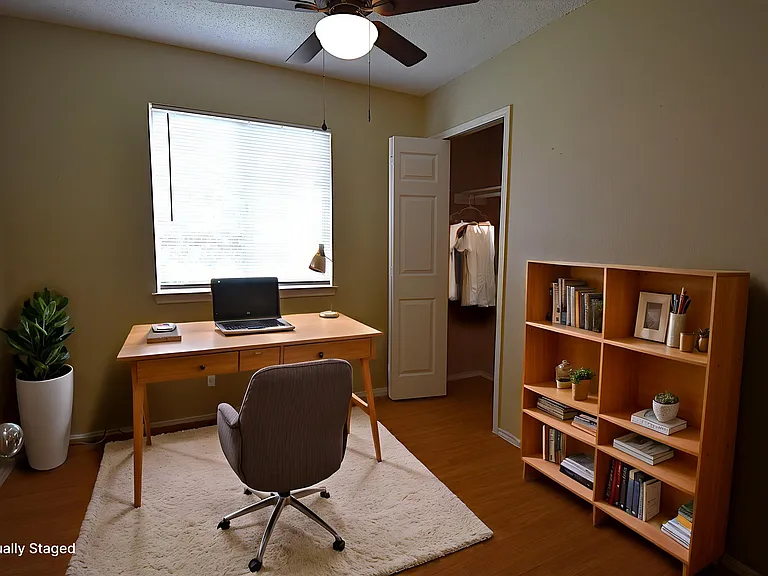 Virtually stage office in one of the guest bedrooms on the second floor