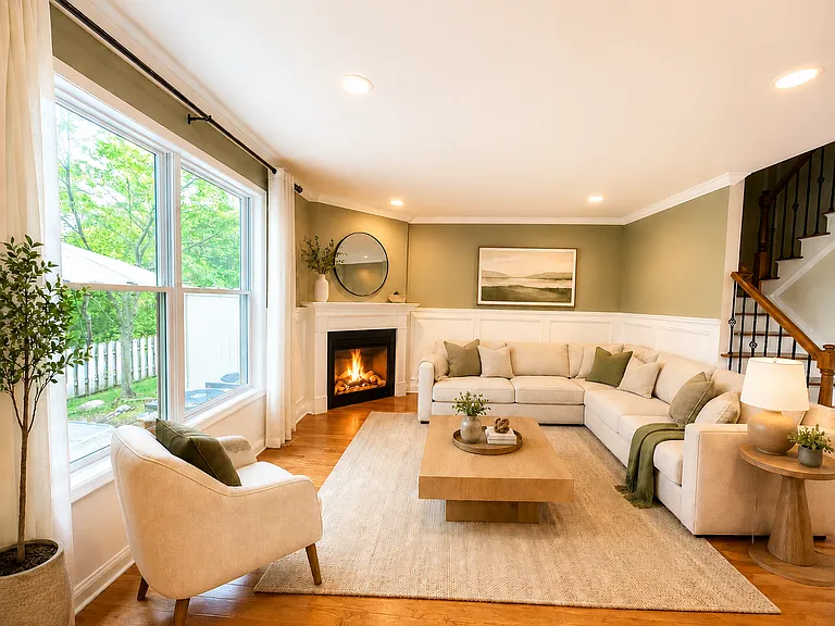 Spacious family room virtually staged to highlight the home's warm, inviting, and functional living space