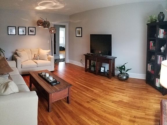 Living room shown furnished by tenant