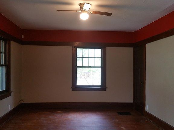 Living Room. Large square room with hardwood floors.