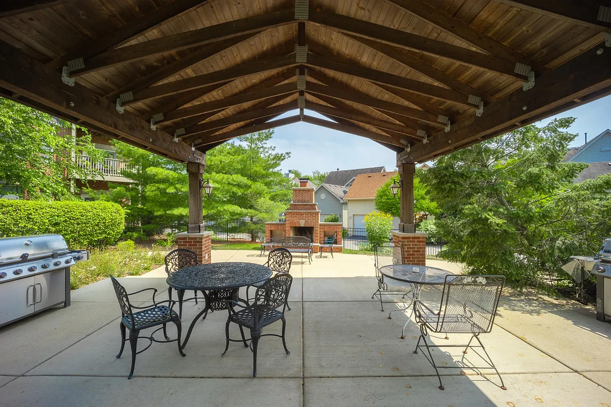 Covered Grill area and Fireplace in background - Residence at Mill Creek
