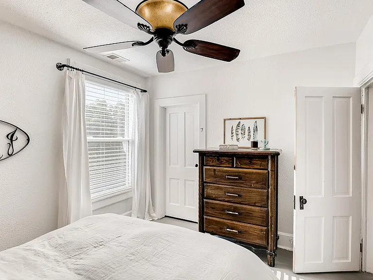 Primary bedroom features king size bed