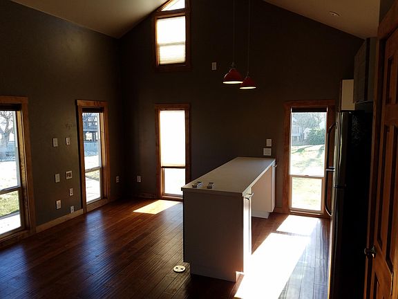 Living/kitchen, looks dark but actually there 's a lot of li