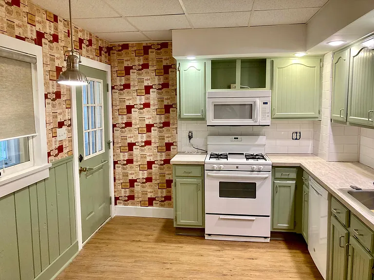 eat-in kitchen with door to 3 season room