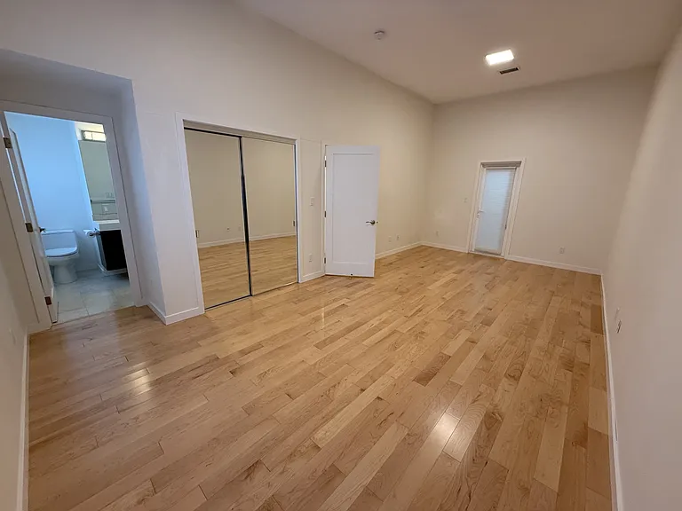 Oversized primary bedroom, with a spacious closet with double mirrored sliding door including a beautiful in-suite bathroom.