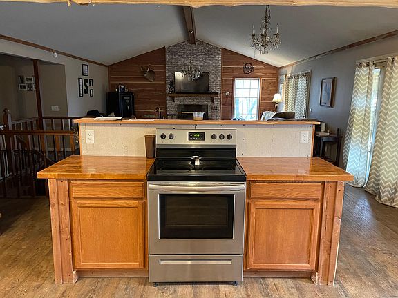 Kitchen island with bar opposite side overlooking the living room area.