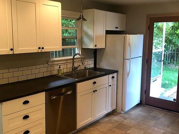 Open kitchen with lots of storage and access to back yard an