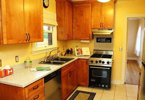 Remodeled kitchen w/Viking gas stove, Corian counters, generous cabinets