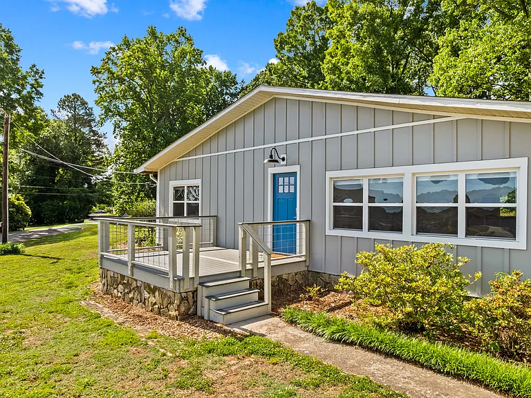 Large front porch with view of lake across the street!