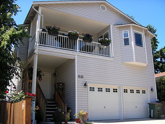 Entry porch, garage, and upper patio.