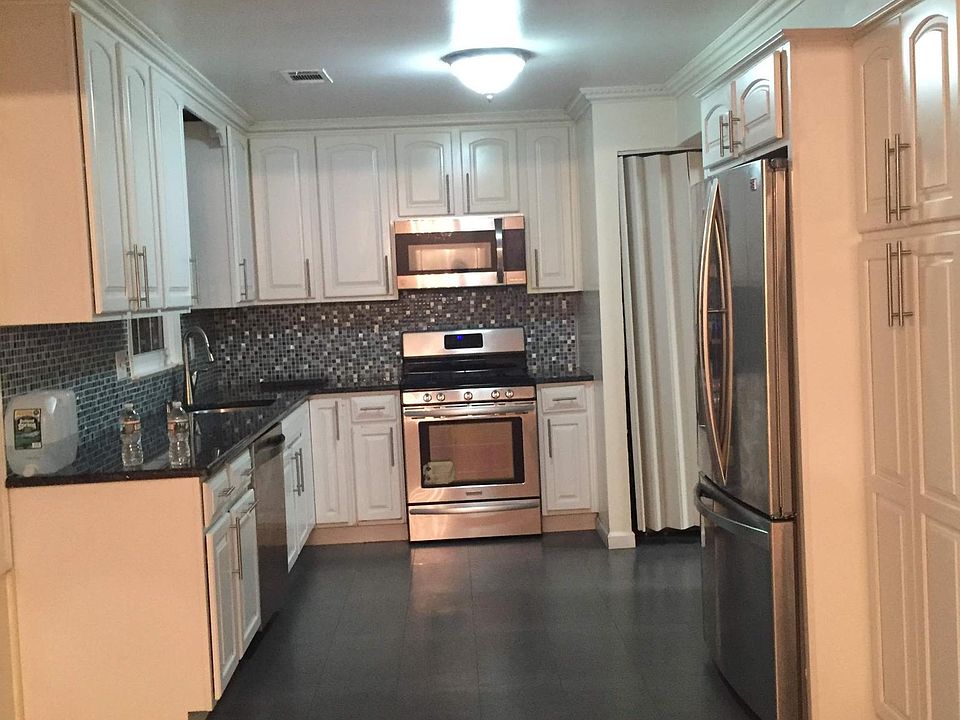 Renovated Kitchen with granite counters , solid wood cabinets and Stainless steel appliances