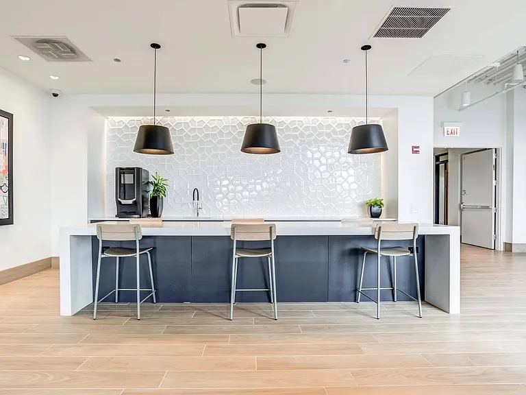 Enjoy the sleek design of the modern lounge kitchen, featuring a stylish bar area perfect for casual meals and entertaining.