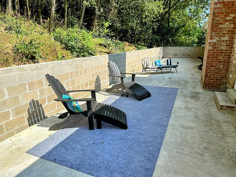 Huge outdoor patio with a private view of nature .