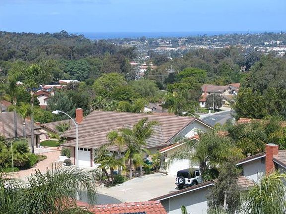Elevated front shows ocean view to rear