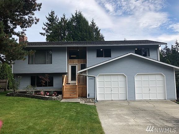 The front of your new home has new siding and paint.  