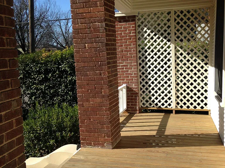 Grand Front Porch with privacy, It has original columns and new decking. A great space for outdoor dining and family and friends to gather.