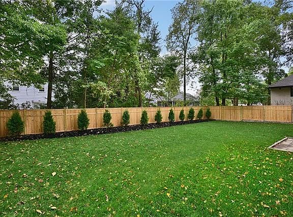 Level yard with plenty of room for a swing set!