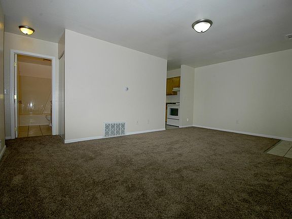Living room to kitchen and bathroom including entry