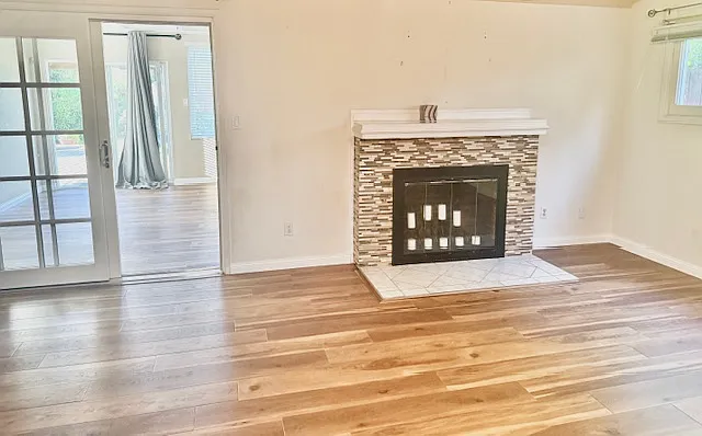 Cozy fireplace in the family room, perfectly positioned to face the dining area. The home is freshly painted throughout and offers a spacious living area_ideal for entertaining or family gatherings.