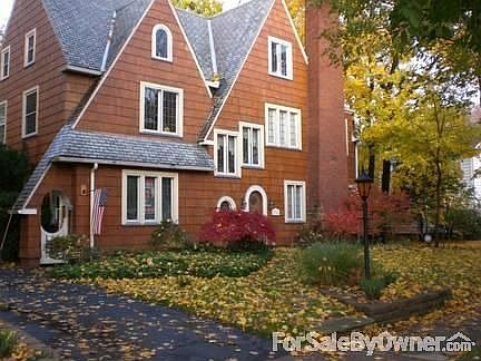 1360 Cleveland Heights Blvd
						:
						Summer Photo: Cedar siding, slate roof, AC, shade trees, patio